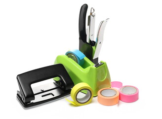 Office supplies, tape holder, paper puncher, and stapler isolated on white background