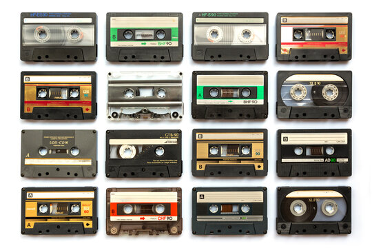 Collection of old audio cassette tapes isolated on white background, vintage music and technology concept