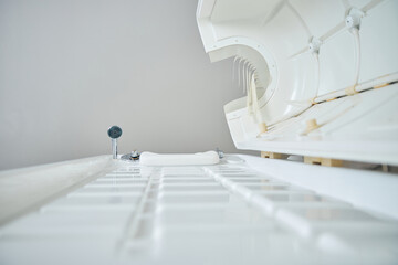 Spacious spa capsule in beauty salon designed in white color