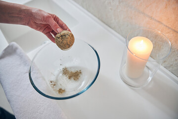 Hand of cosmetologist with ingredients for skin mask