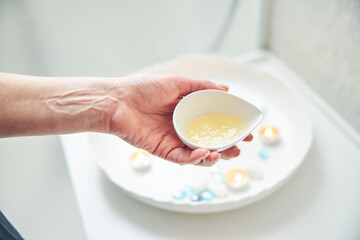 Nourishing body lotion in little bowl for spa treatment