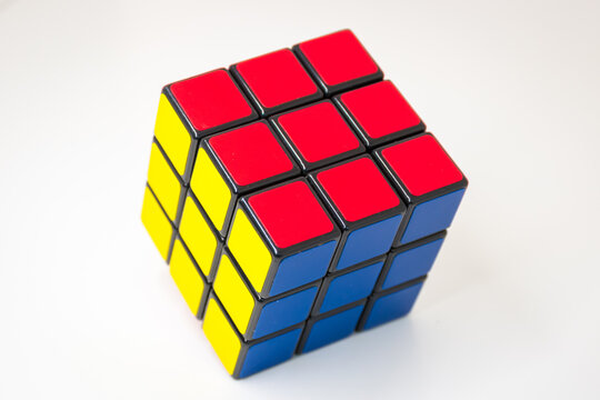 Solved colorful Rubik's Cube puzzle on white background