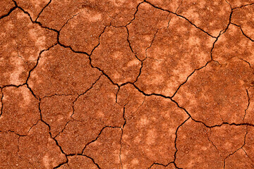 natural crack background on red clay