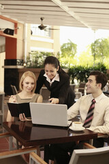 Business people having discussion in a cafe