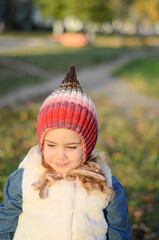 Picture of a blonde toddler girl in the funny knitted hat