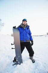 Fototapeta na wymiar Man with snowboard