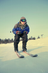 Fototapeta na wymiar Man skiing on winter day