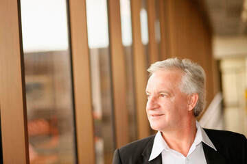 Businessman waiting for his flight in airport lounge