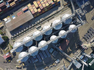 Aerial view oil terminal is industrial facility for storage of oil and petrochemical products ready for transport to further storage facilities.