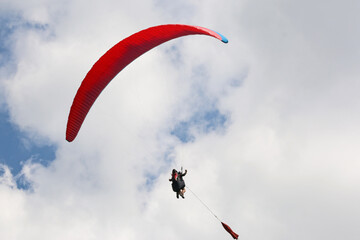 Paraglider being towed on a winch launch