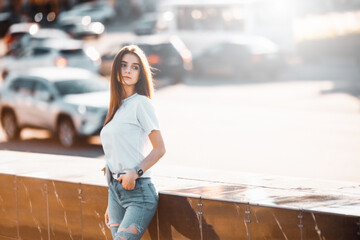 Summer sunny lifestyle fashion portrait. Young stylish hipster woman