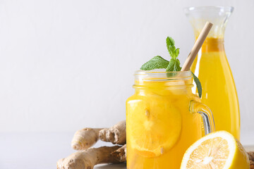 Indonesian herbal beverage Jamu with turmeric, ginger, lemon. Close up.