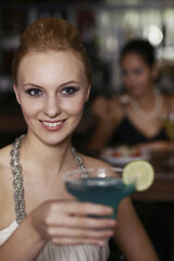 Woman with a glass of cocktail