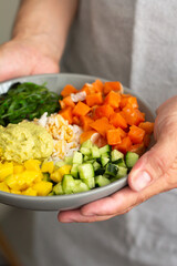 poke with salmon, seaweed and vegetables.