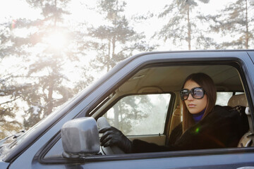 Businesswoman driving on winter day