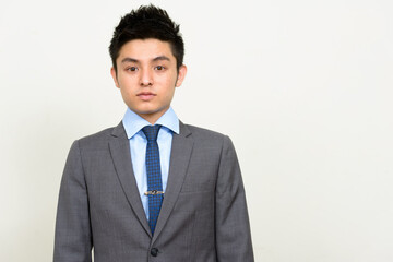 Portrait of young handsome Asian businessman in suit