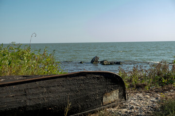 Old boat abandoned in Danube Delta area,  Romania,  photographed in a sunny summer day