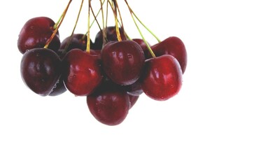 bunch of fresh cherries on a white background