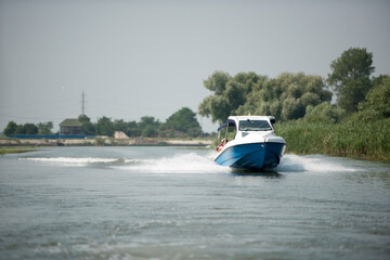 Boat on Danube river,  Danube delta area,  Romania,  in a sunny summer day