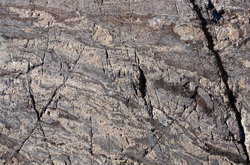 Abstract background, stone surface, texture of stone, moss, cracks, facets