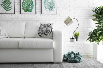 Comfortable white sofa in modern room. Interior design