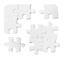 Set with jigsaw puzzle pieces on white background, top view