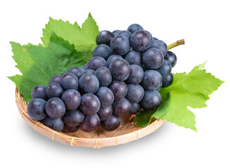 Black Wine grape in Bamboo basket isolated on white background, Kyoho Grape with leaves on white...