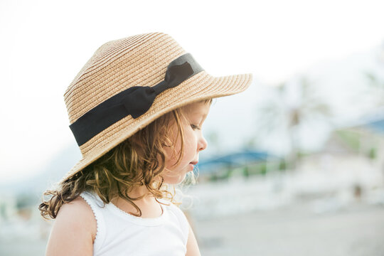 Pretty Child Girl In Hat On The Beach With Sea View.Vacation,summer Concept