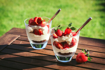 Easy summer dessert in glass with mascarpone cream and strawberries