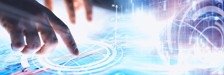Business concept. Information technology and data processing. Hands over the screen with graphic...