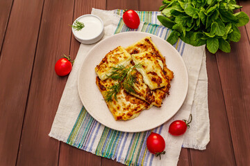 Hot appetizer - pita bread with cheese and herbs. Vegetarian healthy food