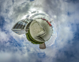 Little planet from a jetty with tugboats in the port of Hamburg 