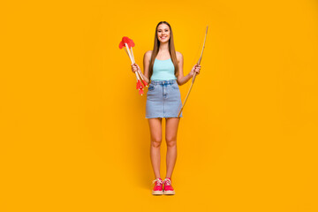 Full length body size view of her she nice attractive cheerful straight-haired girl holding in hands festal love arrows amour service isolated on bright vivid shine vibrant yellow color background