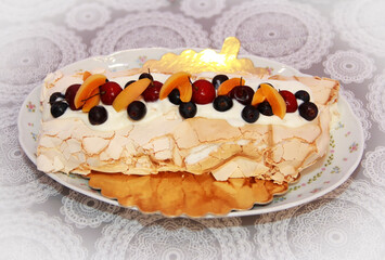 sweet baked cake decorated with fruit, apricots and a cherries