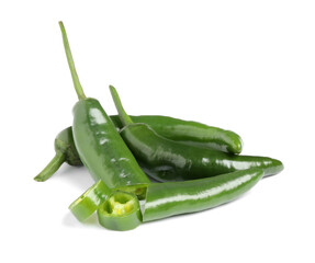 Cut and whole green hot chili peppers on white background