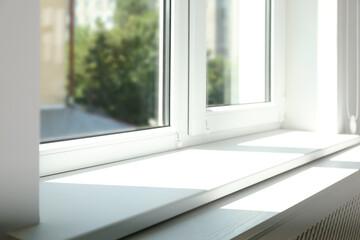 Closeup view of window with empty white sill - obrazy, fototapety, plakaty