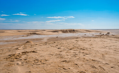 salt marsh in the Sahara desert between sand dunes