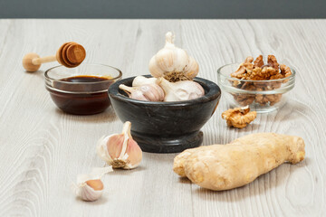 Health remedy relief foods for cold and flu on a gray wood boards.