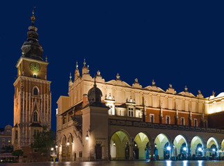 Naklejka na ściany i meble The Cloth Hall and Clock tower in Krakow's Old Town Market Square, Poland