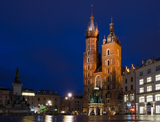 Fototapeta na wymiar Krakow Market Square empty at Blue Hour with the Basilica and monument