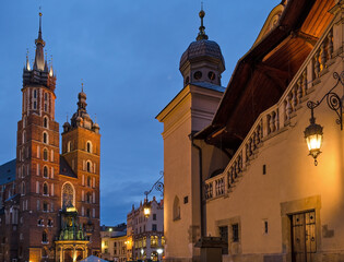 Fototapeta na wymiar Cloth Hall and Town Hall Tower illuminated at sunrise - Krakow, Poland