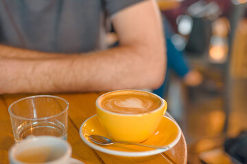 Beautiful latte art coffee with heart on the table