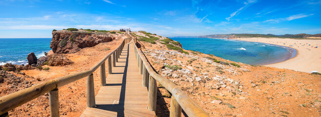 wooden boardwalk to bordeira beach, algarve Portugal