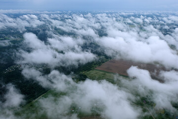 Nature. Clouds in the sky above the earth. View from above.