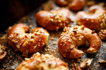Homemade yeast croissants with cinnamon and walnuts close up viewYeast croissants with cinnamon and walnuts, close up view