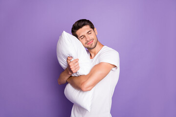 Portrait of his he nice attractive sleepy dreamy guy holding in hands embracing pillow drowsing...