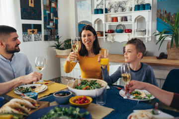 family gathering having dinner or lunch party at home