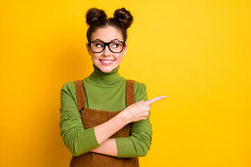 Portrait of positive cheerful girl point index finger copyspace present adverts promo recommend...