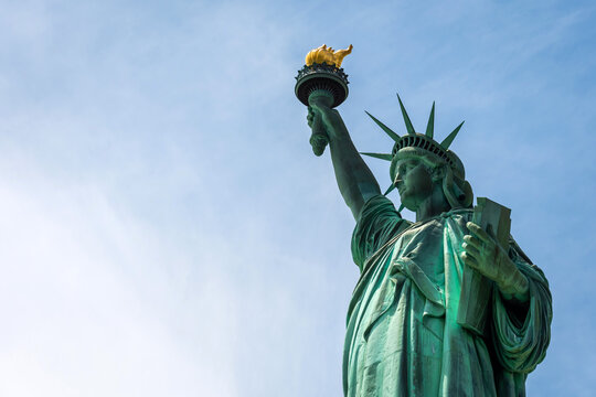Statue of Liberty close up in a sunny day, blue sky in New York - Image