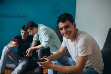 Fototapeta premium teenagers using mobile phone at home